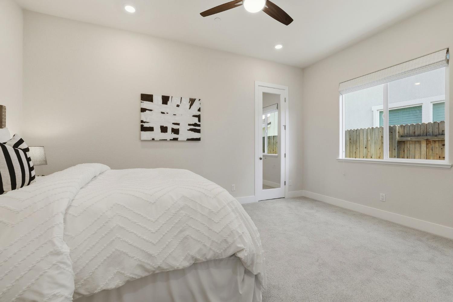 2121 Arbor Rdg Drive Roseville, CA 95747 - Photo 12 of 83 a bedroom with a large bed and a window