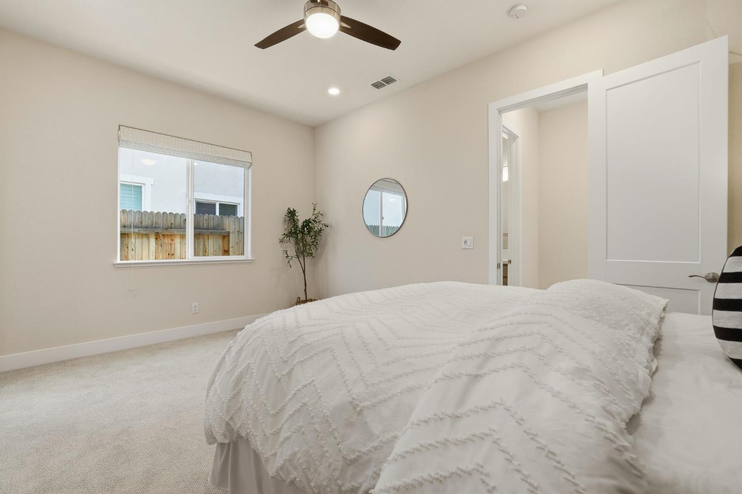 2121 Arbor Rdg Drive Roseville, CA 95747 - Photo 14 of 83 a bedroom with a large bed and a window