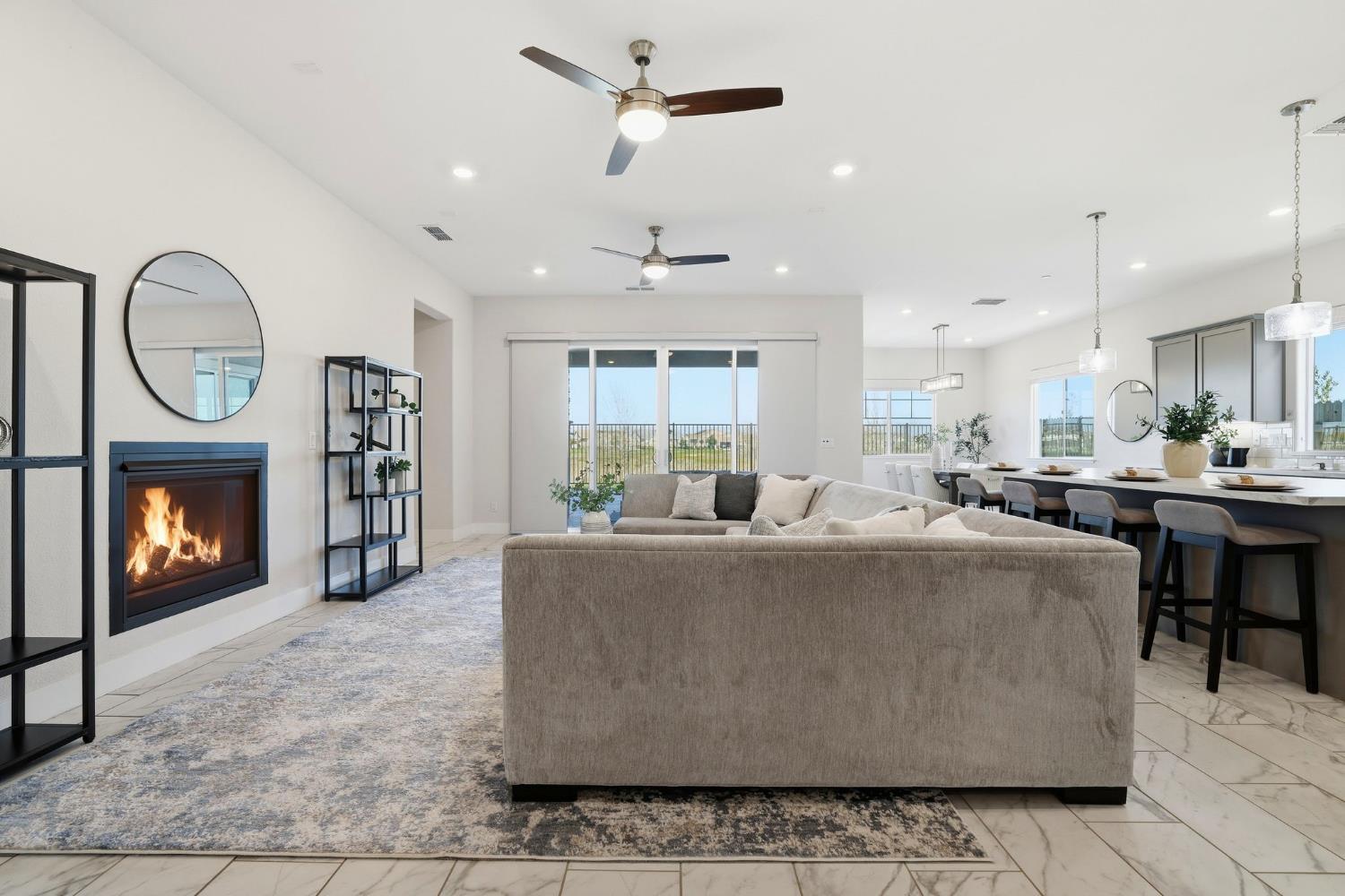 2121 Arbor Rdg Drive Roseville, CA 95747 - Photo 27 of 83 a living room with furniture a fireplace and a ceiling fan