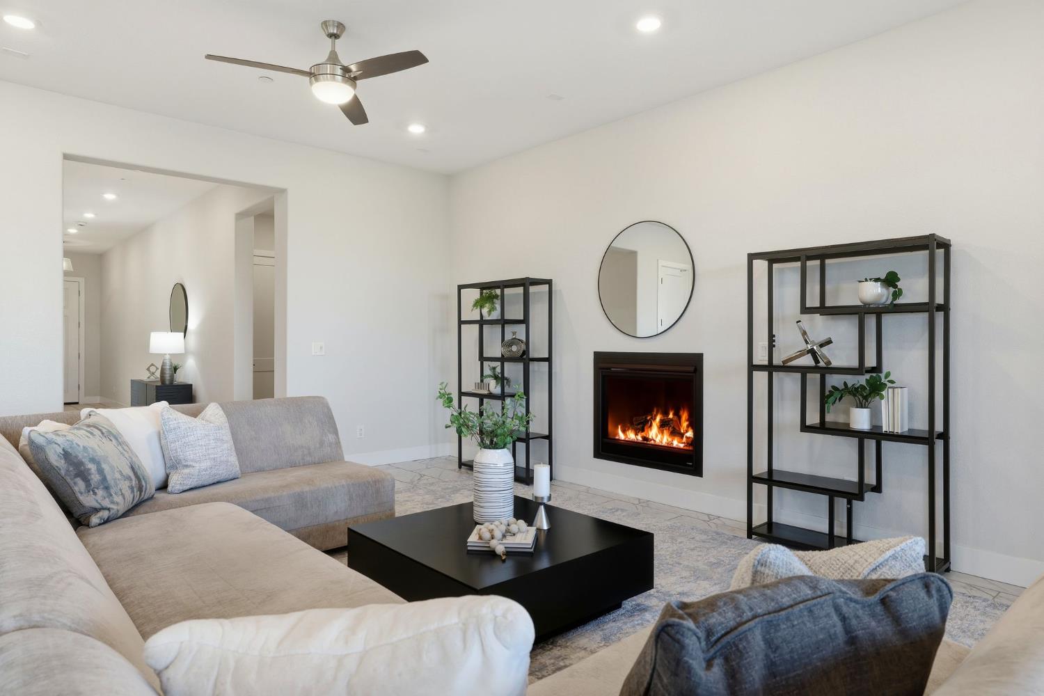 2121 Arbor Rdg Drive Roseville, CA 95747 - Photo 31 of 83 a living room with furniture a fireplace and a potted plant