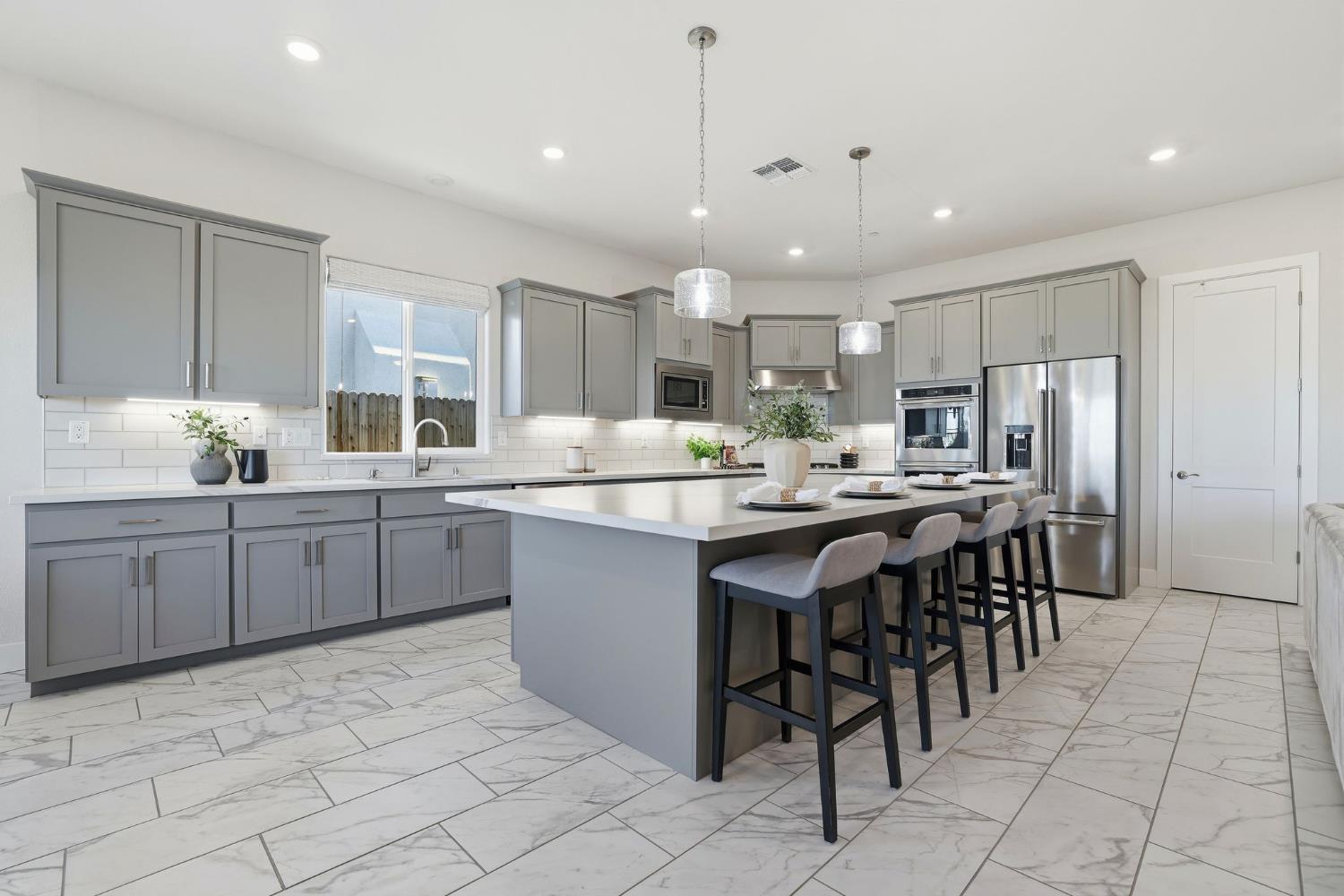 2121 Arbor Rdg Drive Roseville, CA 95747 - Photo 37 of 83 a kitchen with kitchen island granite countertop a sink counter top space appliances and cabinets