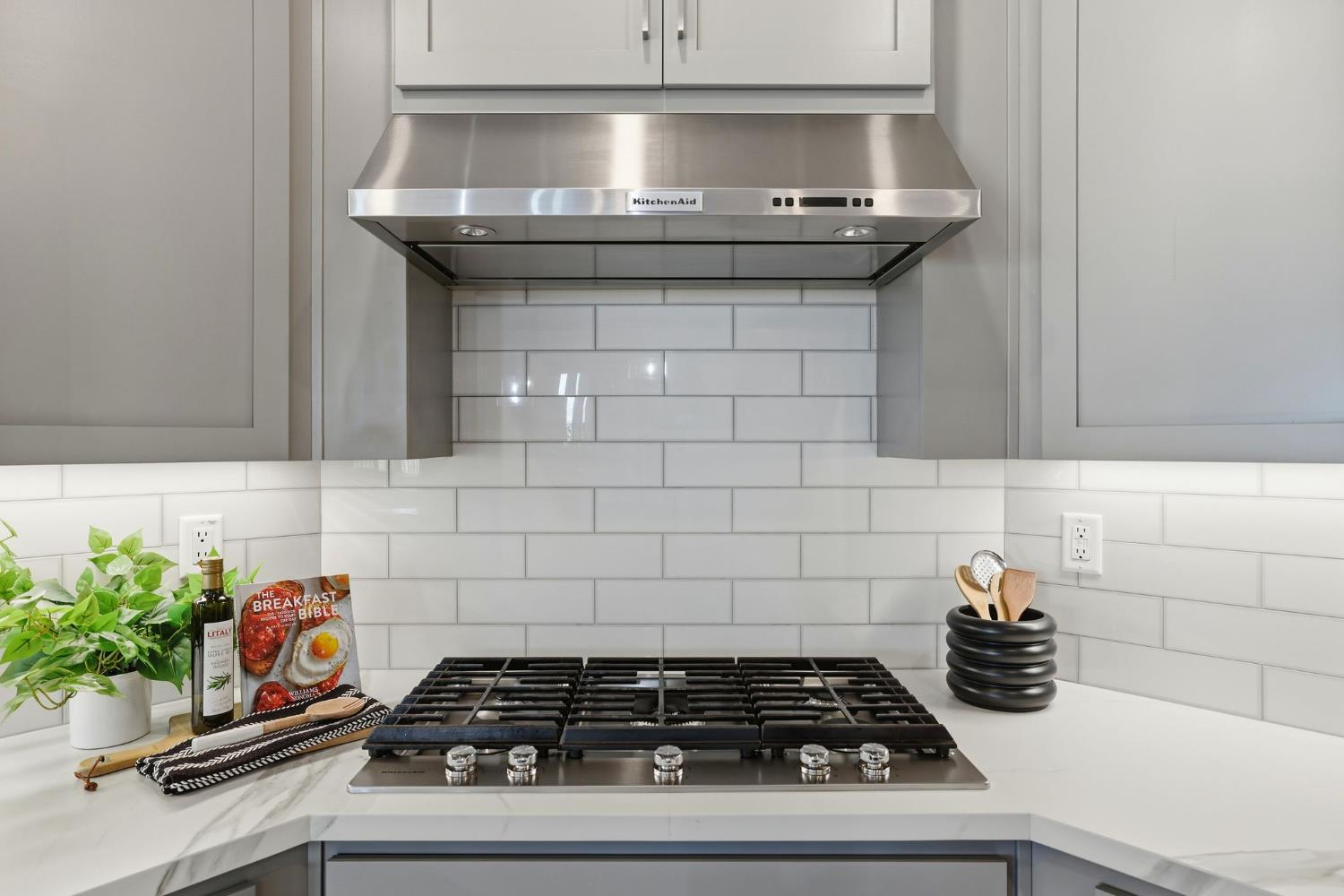 2121 Arbor Rdg Drive Roseville, CA 95747 - Photo 42 of 83 a close view of a stove a microwave and cabinets