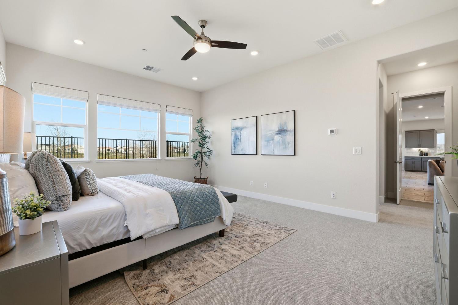 2121 Arbor Rdg Drive Roseville, CA 95747 - Photo 49 of 83 a bedroom with a large bed and a chandelier