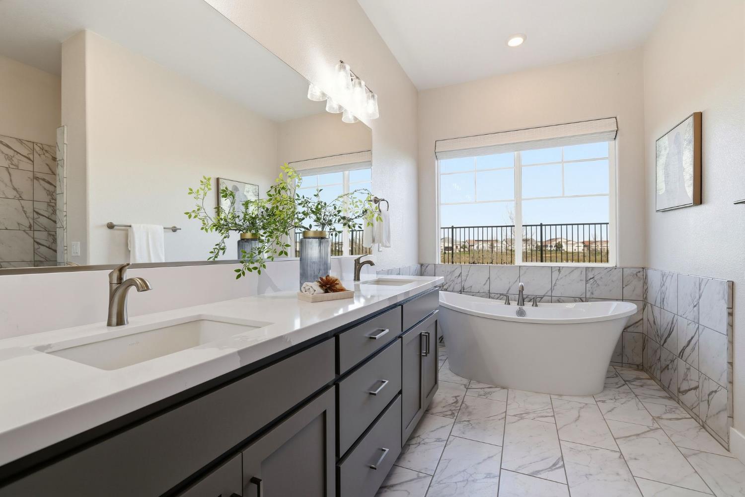 2121 Arbor Rdg Drive Roseville, CA 95747 - Photo 56 of 83 a bathroom with a double vanity sink a large mirror and bathtub