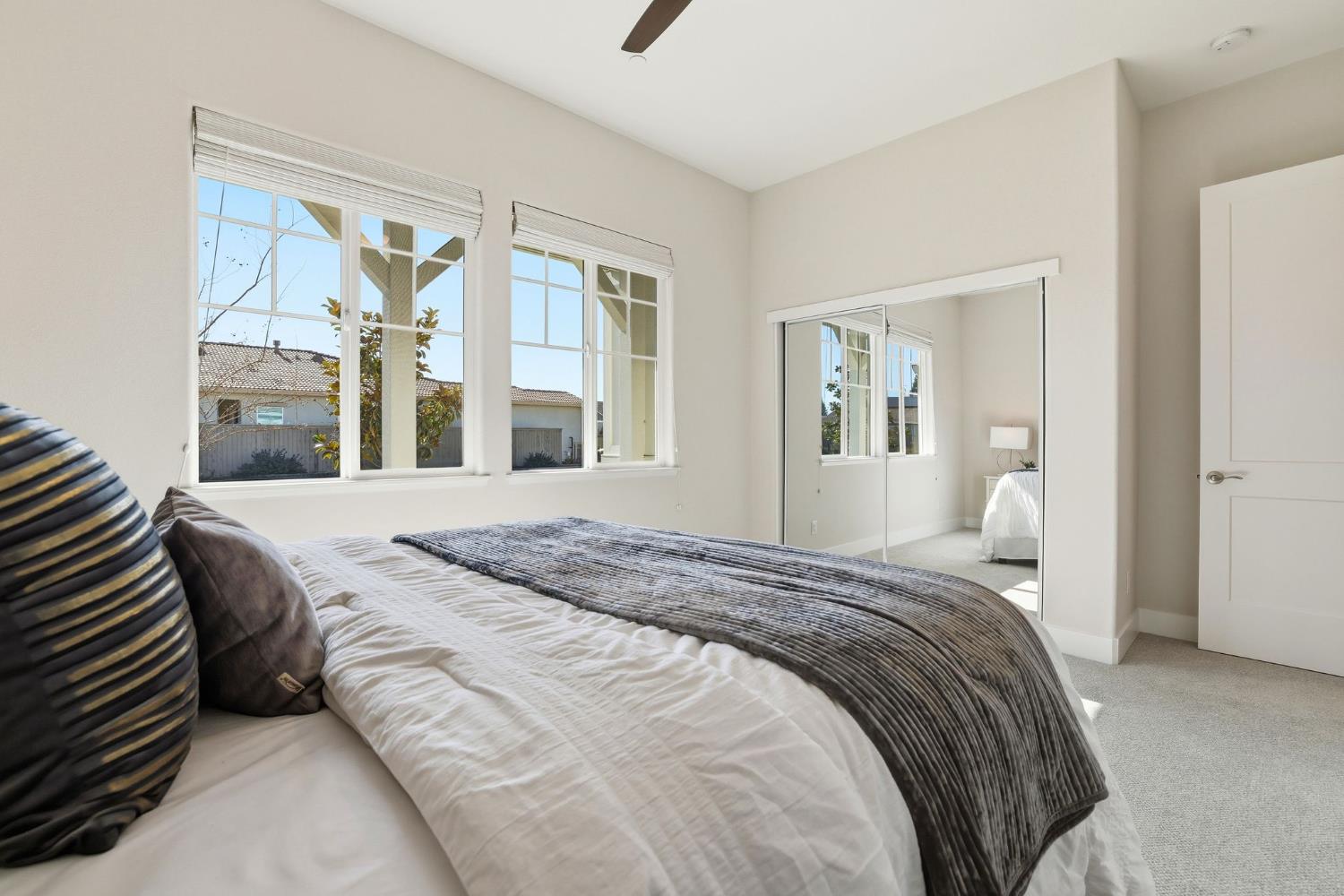 2121 Arbor Rdg Drive Roseville, CA 95747 - Photo 10 of 83 a bedroom with a large bed and a large window
