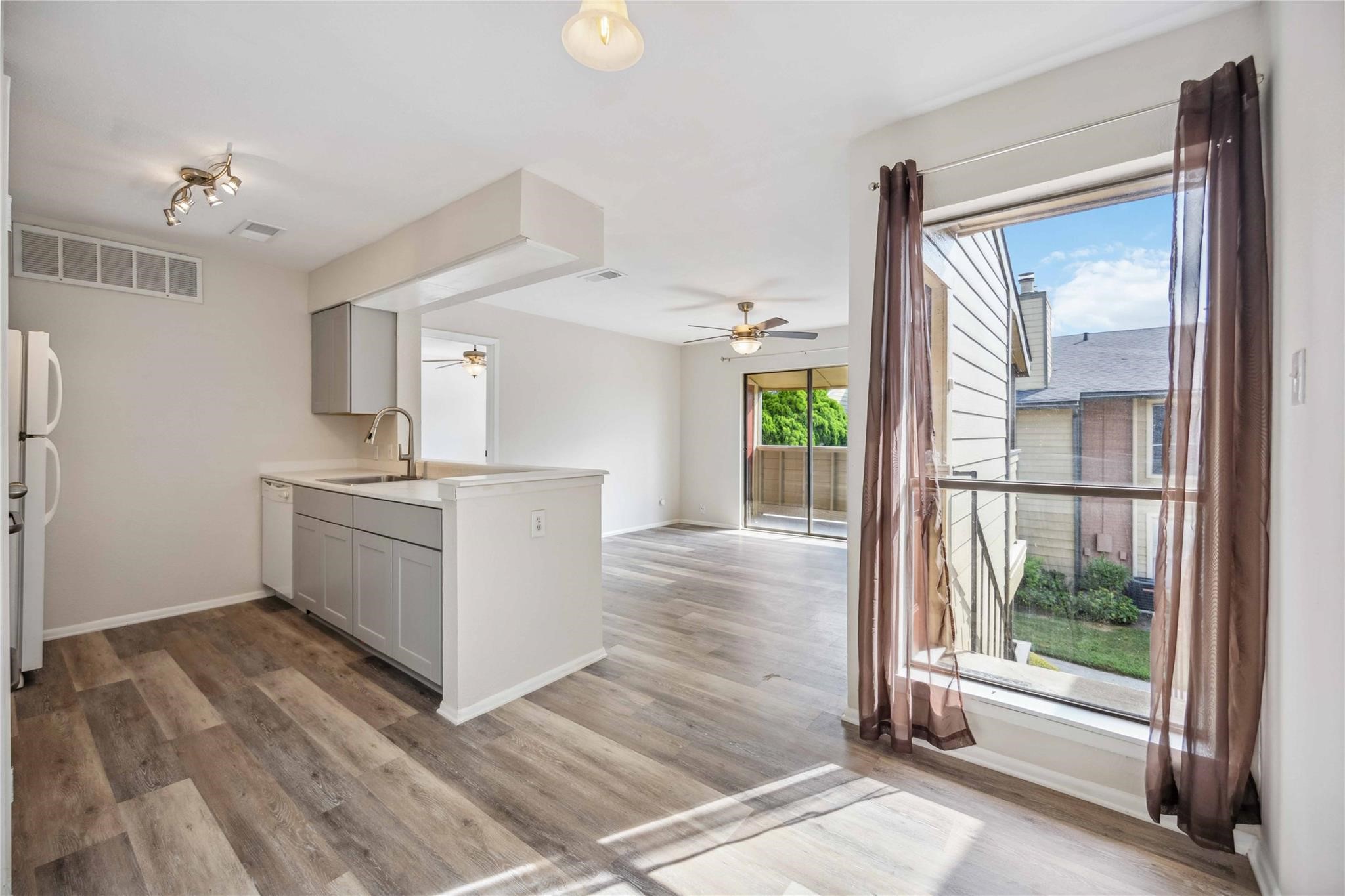 15534 Zabolio Drive, Unit 241 Houston, TX 77598 - Photo 11 of 21 a view of a kitchen with a sink and a large window
