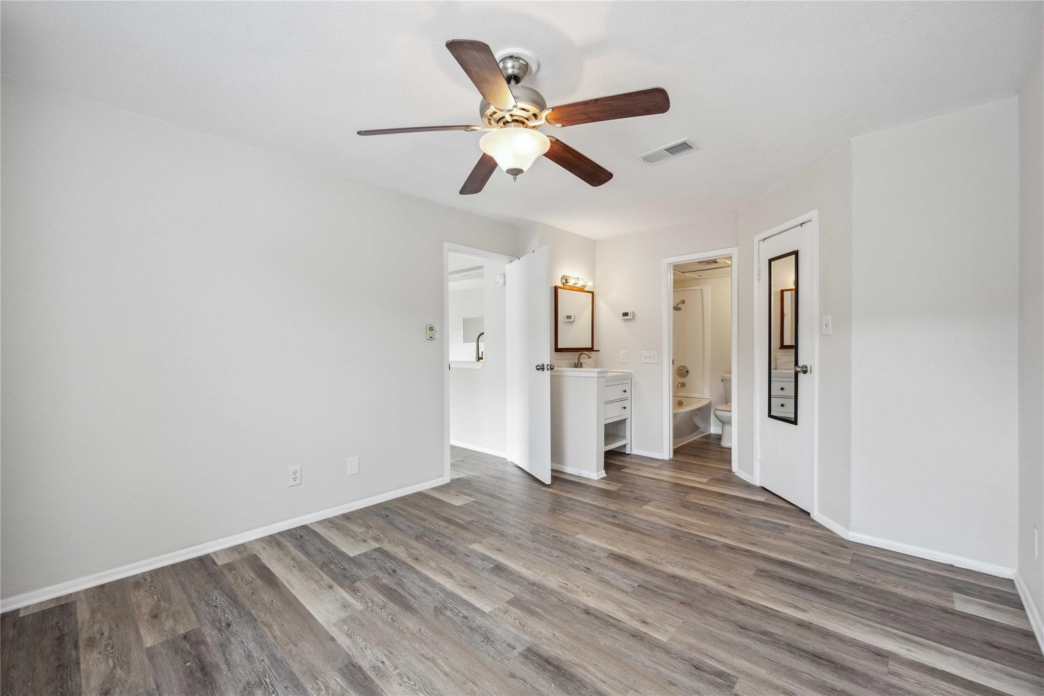 15534 Zabolio Drive, Unit 241 Houston, TX 77598 - Photo 13 of 21 a view of empty room with wooden floor