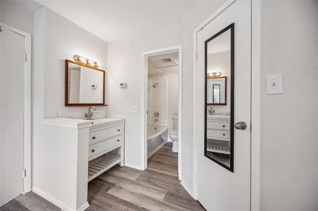 wooden floor in white room