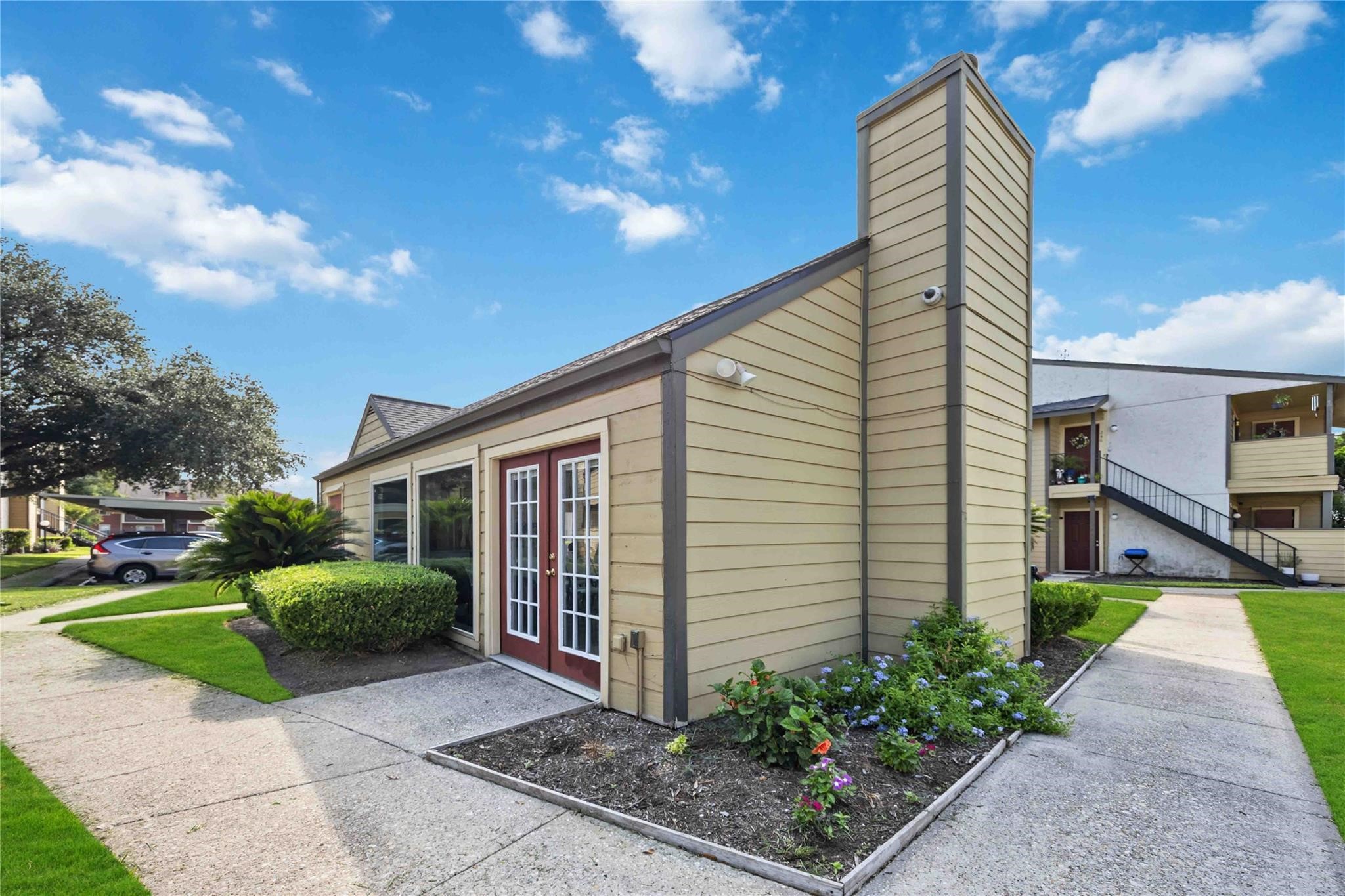 15534 Zabolio Drive, Unit 241 Houston, TX 77598 - Photo 19 of 21 a view of a house with a backyard