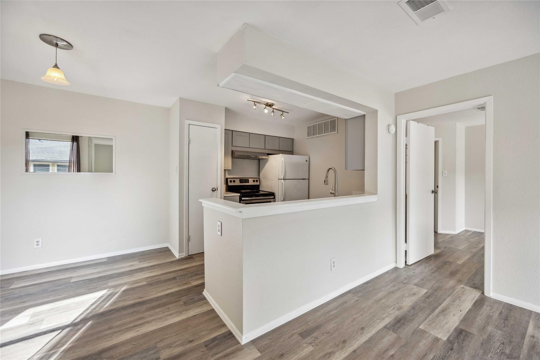 15534 Zabolio Drive, Unit 241 Houston, TX 77598 - Photo 7 of 21 a kitchen with a refrigerator and a stove top oven