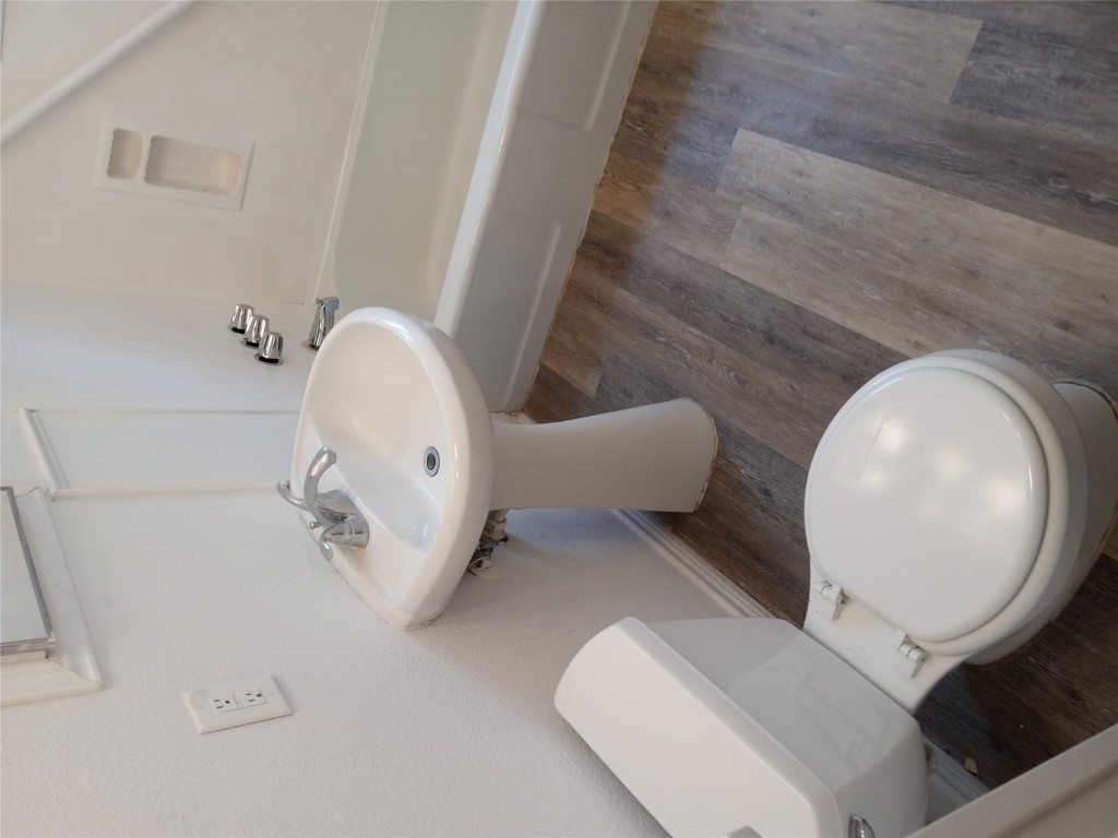 1505 Oreilly Court, Unit C Austin, TX 78734 - Photo 14 of 19 Full bath with wood finished floors and bathing tub / shower combination