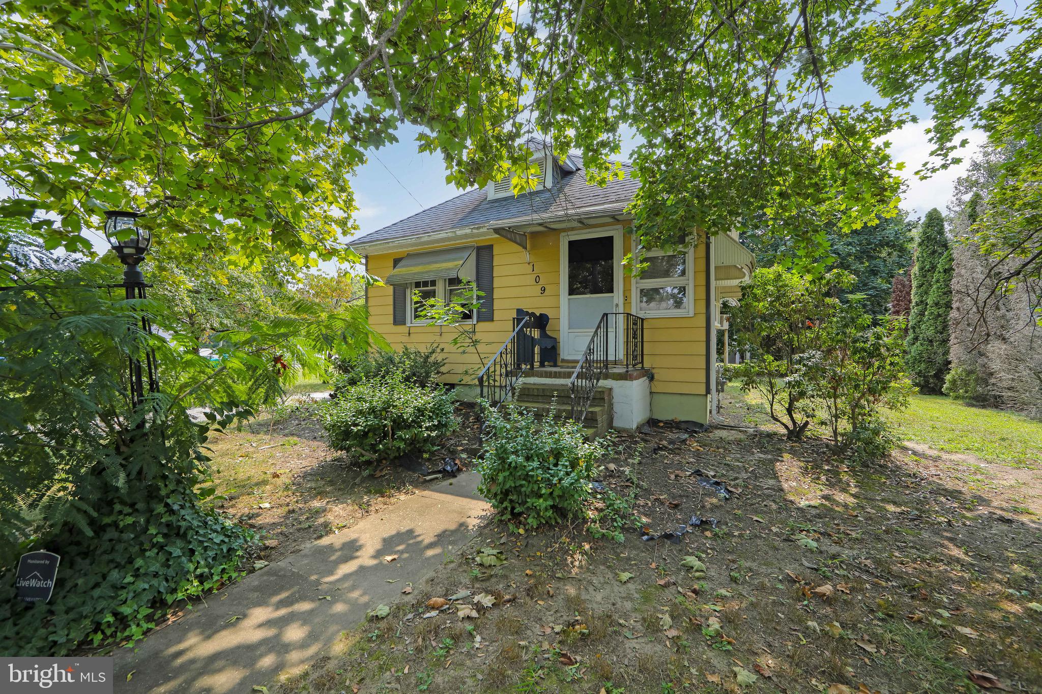 109 Rena Street Newfield, NJ 08344 - Photo 1 of 38 a front view of a house with garden