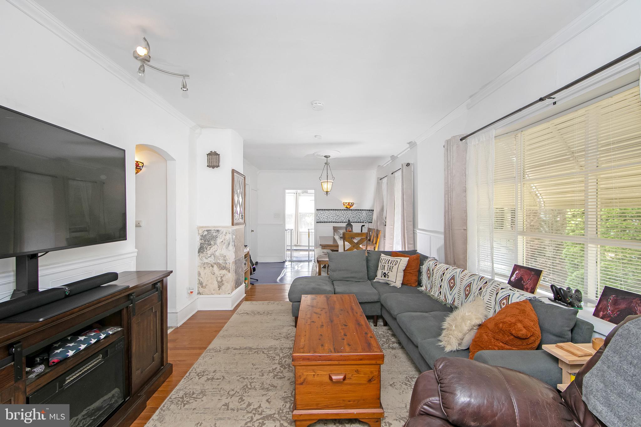 109 Rena Street Newfield, NJ 08344 - Photo 4 of 38 a living room with furniture and a flat screen tv