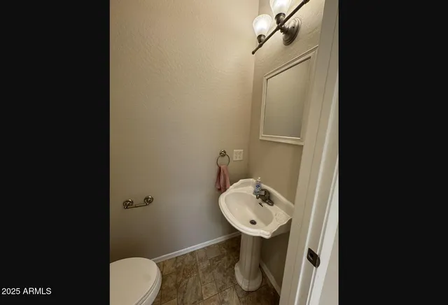 a bathroom with a sink toilet