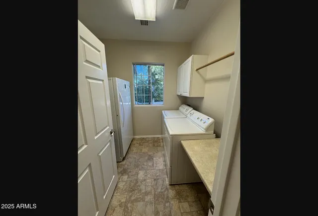 a view of hallway with washer and dryer