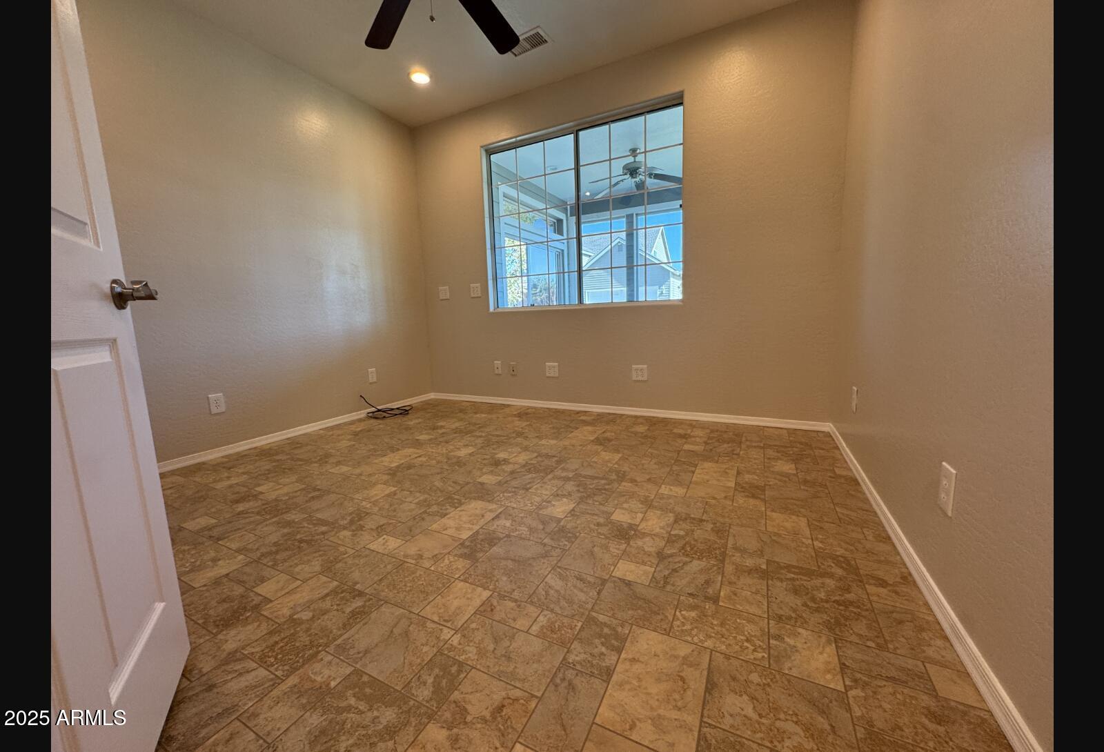 505 Raysun Lane Camp Verde, AZ 86322 - Photo 24 of 50 an empty room with windows and entrance