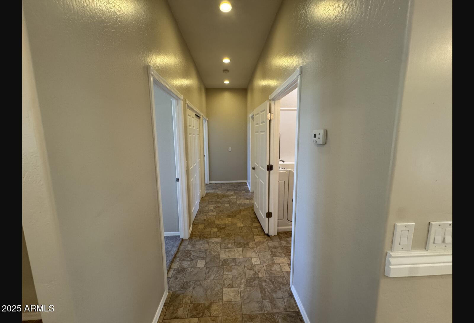 505 Raysun Lane Camp Verde, AZ 86322 - Photo 26 of 50 a view of a hallway with a livingroom and a bathroom with sink