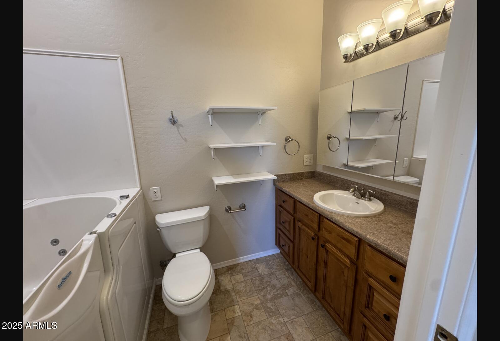 505 Raysun Lane Camp Verde, AZ 86322 - Photo 29 of 50 a bathroom with a granite countertop toilet sink and mirror