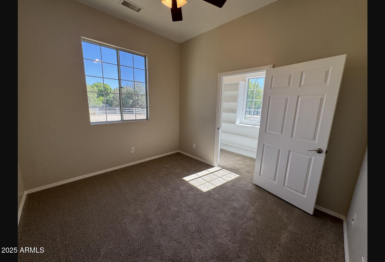 505 Raysun Lane Camp Verde, AZ 86322 - Photo 36 of 50 an empty room with windows and closet