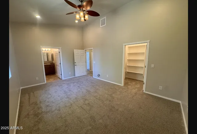 a bathroom with a toilet and a mirror
