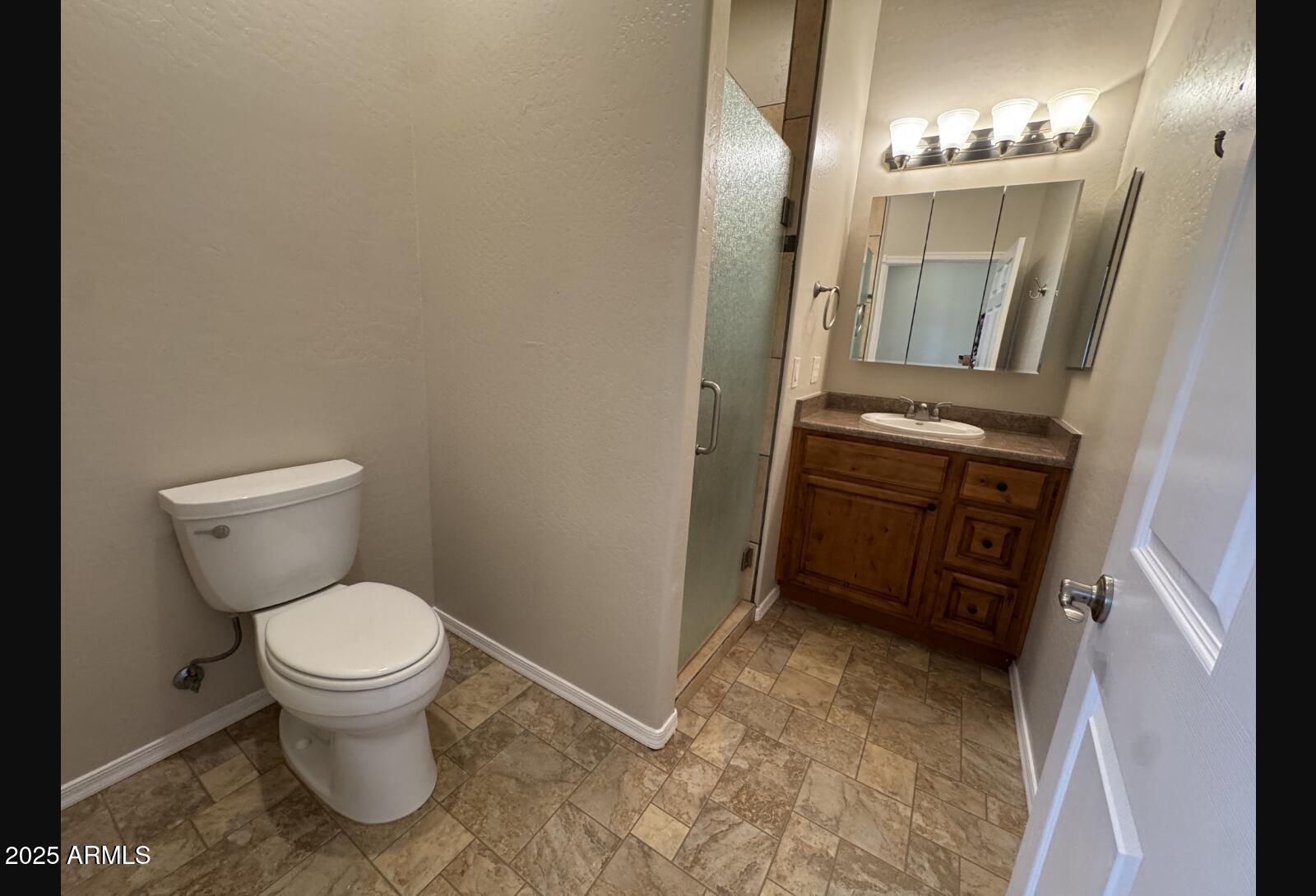 505 Raysun Lane Camp Verde, AZ 86322 - Photo 40 of 50 a bathroom with a toilet and a mirror