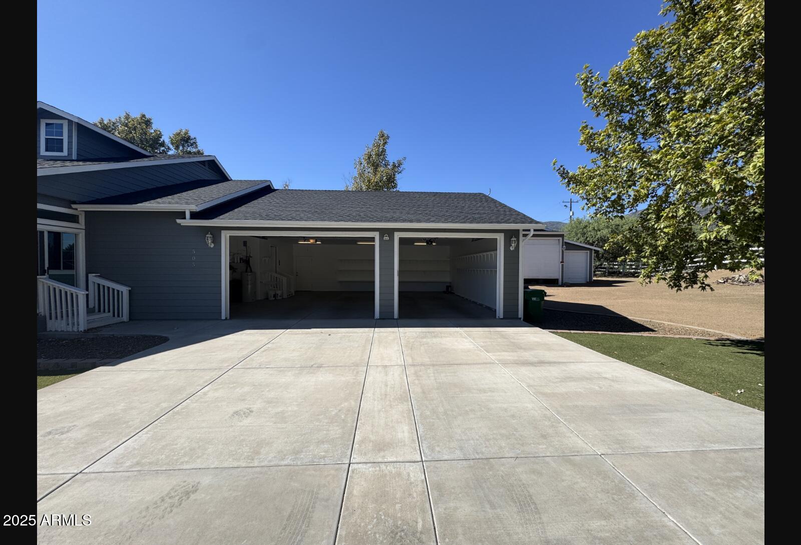 505 Raysun Lane Camp Verde, AZ 86322 - Photo 4 of 50 a front view of a house with a yard and garage