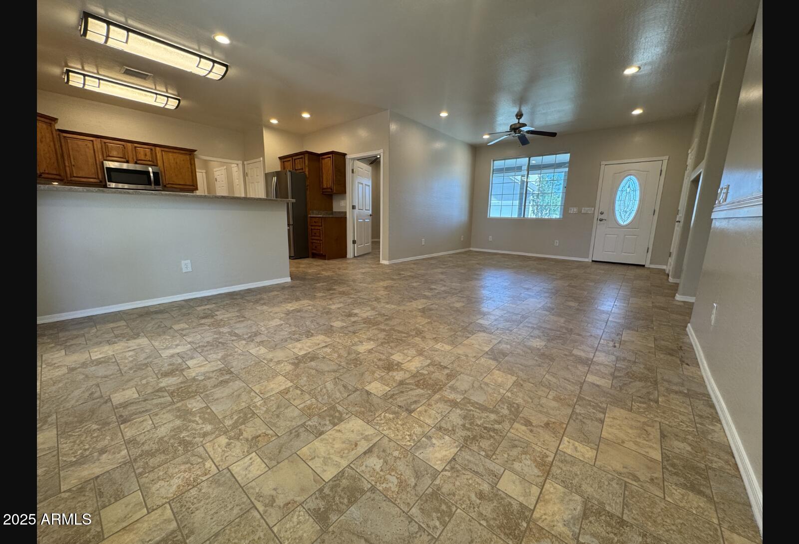 505 Raysun Lane Camp Verde, AZ 86322 - Photo 9 of 50 a view of an empty room with kitchen and window