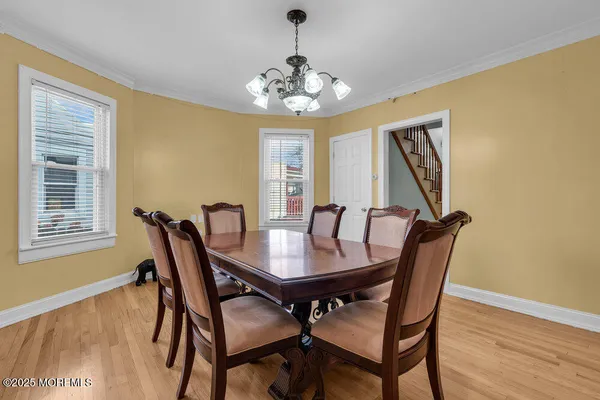 a view of a dining room with furniture and window
