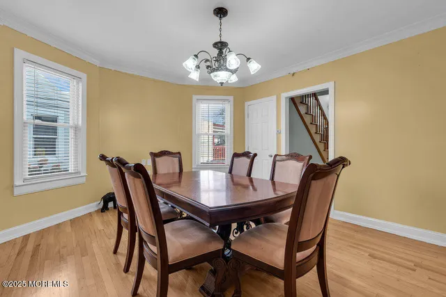 a view of a dining room with furniture and window