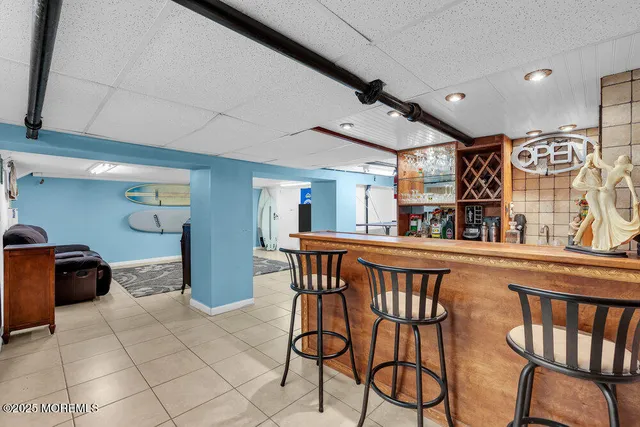 a dining area with furniture and window