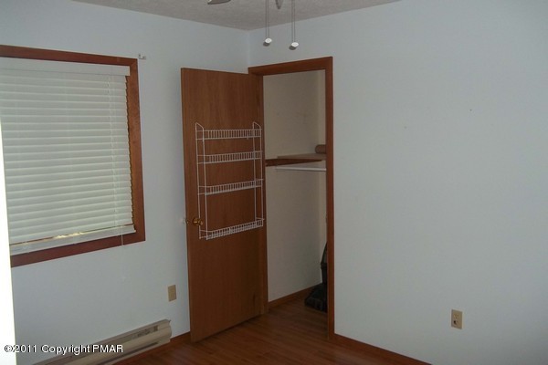 2721-19 Radcliff Road Bushkill, PA 18324 - Photo 5 of 19 a view of walk in closet with empty racks