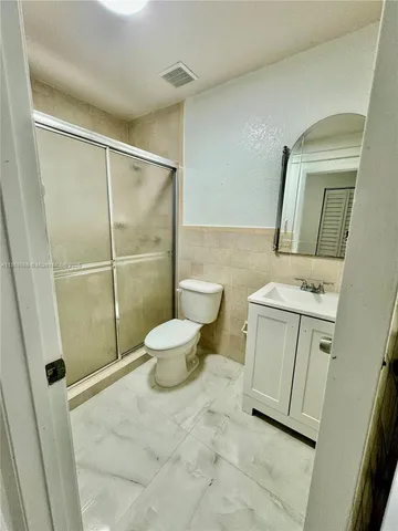 a bathroom with a toilet and a sink