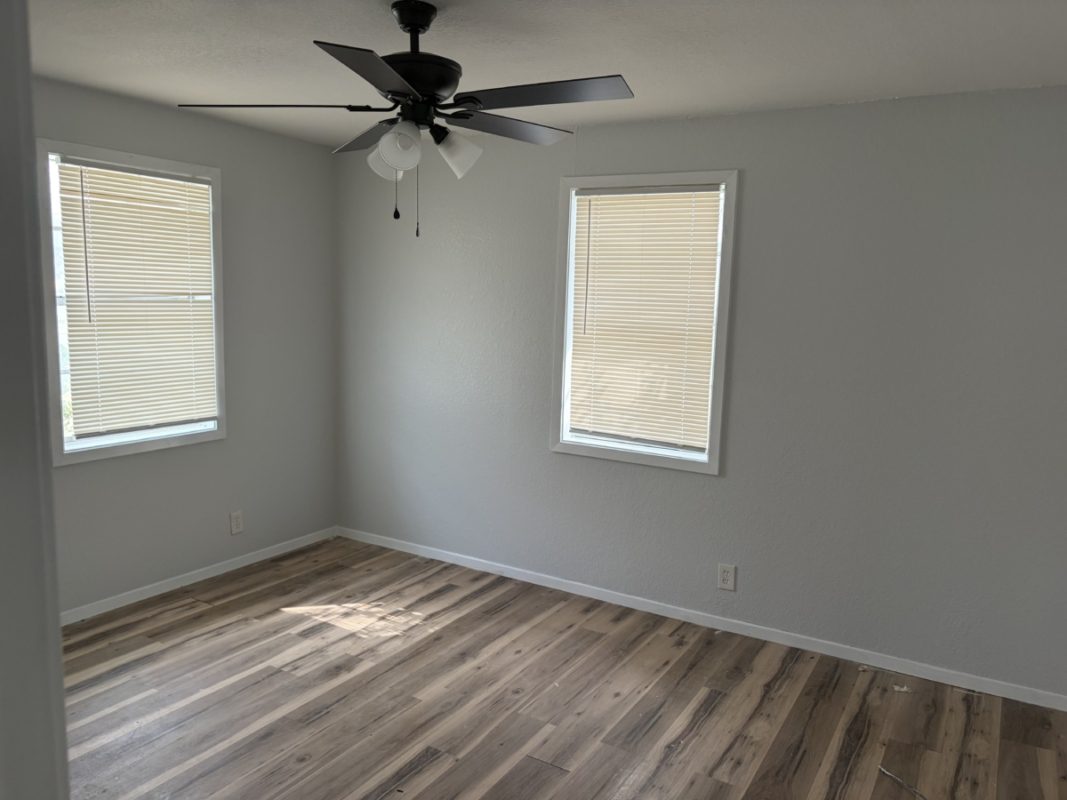 604 West 4th Street Taylor, TX 76574 - Photo 6 of 8 Unfurnished room with wood finished floors and ceiling fan