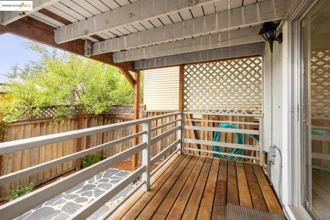 a view of balcony with wooden floor