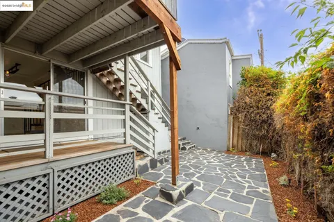 a view of a house with a door and wooden floor