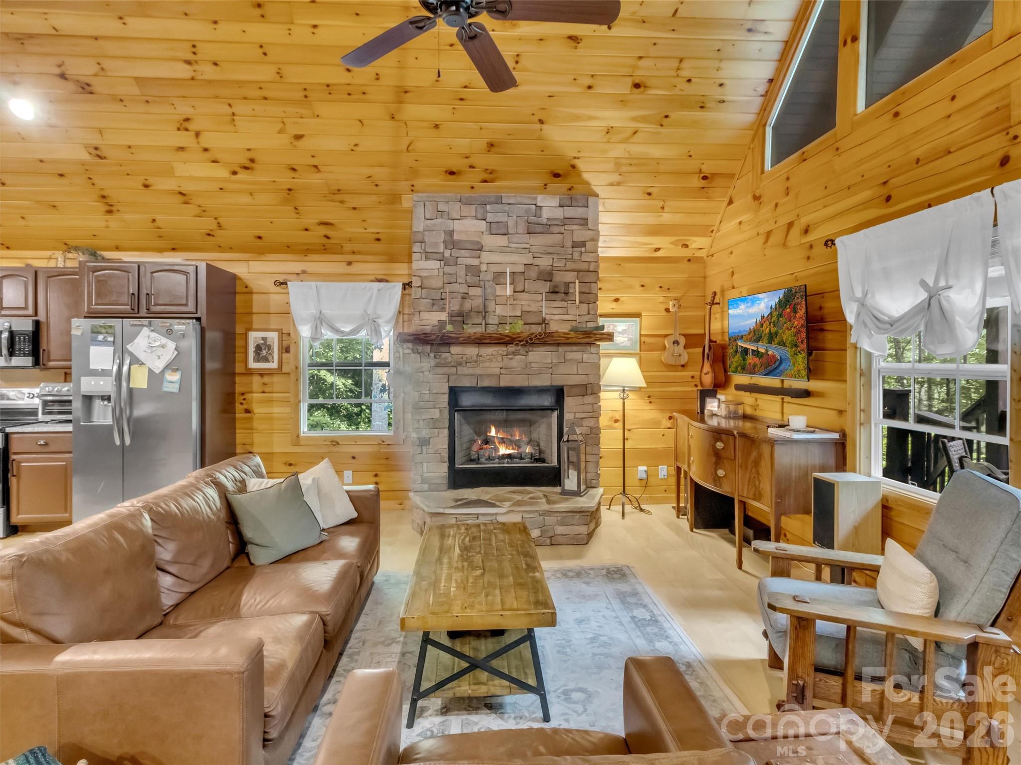 49 Brandywine Road Waynesville, NC 28786 - Photo 9 of 38 a living room with patio fireplace furniture and a fireplace