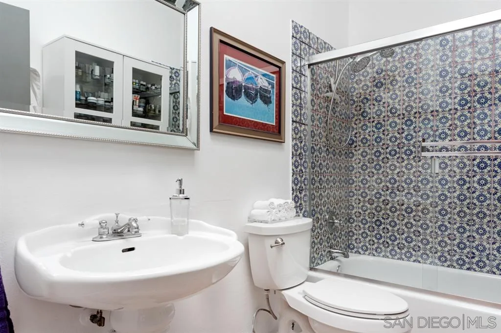 8328 Regents Road, Unit 3G San Diego, CA 92122 - Photo 11 of 39 a bathroom with a sink toilet and a mirror