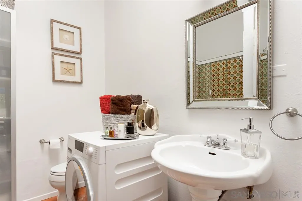 8328 Regents Road, Unit 3G San Diego, CA 92122 - Photo 13 of 39 a bathroom with a sink and a mirror