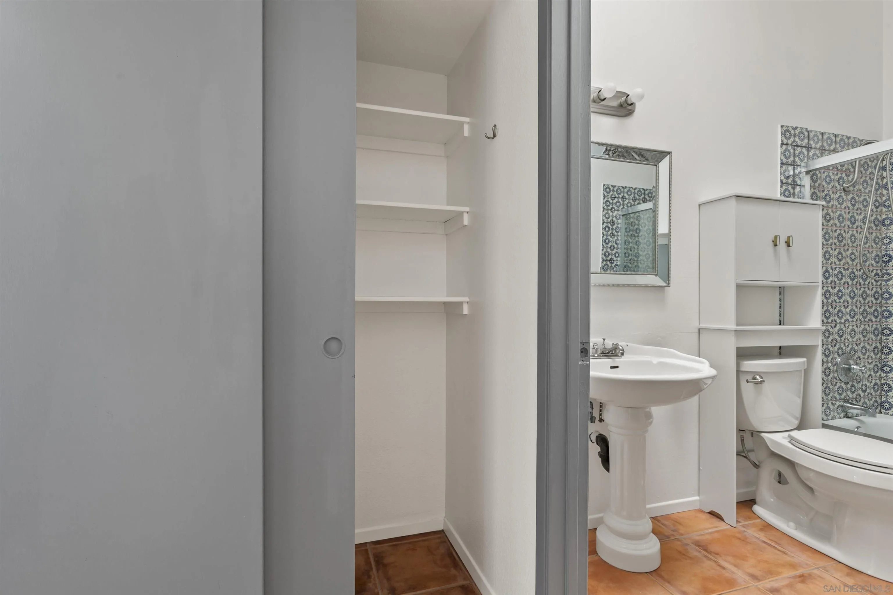 8328 Regents Road, Unit 3G San Diego, CA 92122 - Photo 23 of 39 a bathroom with a toilet sink and a mirror