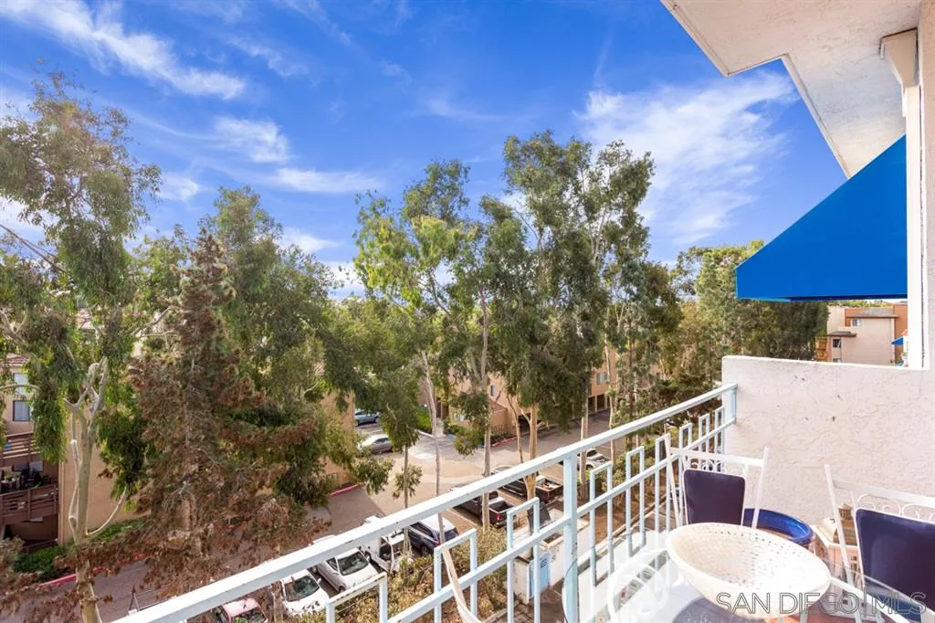 8328 Regents Road, Unit 3G San Diego, CA 92122 - Photo 5 of 39 a view of a balcony with wooden floor and fence