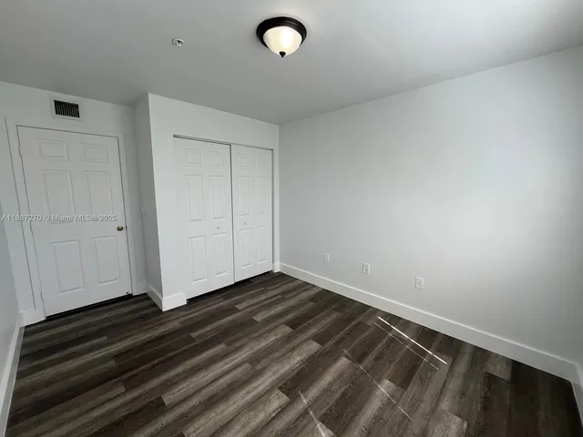 a view of room with hardwood floor