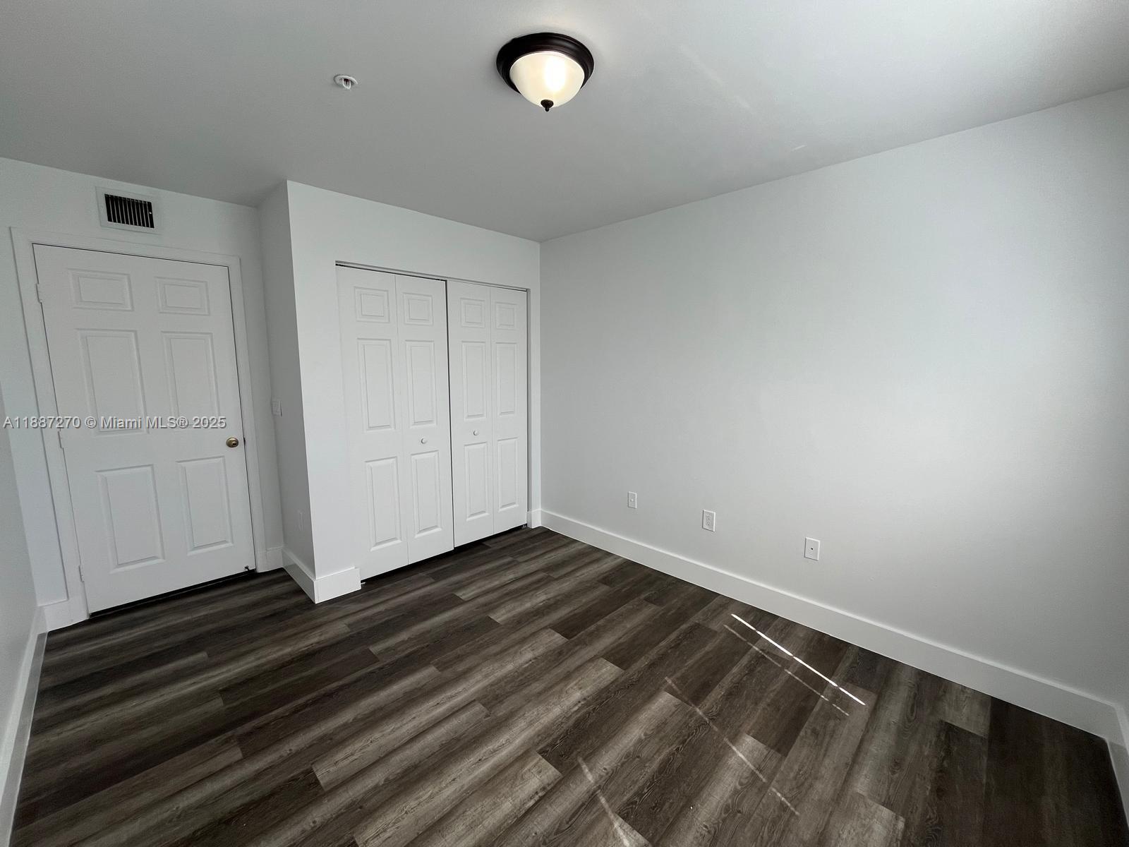 655 Southwest 111th Way, Unit 308 Pembroke Pines, FL 33025 - Photo 13 of 42 a view of room with hardwood floor