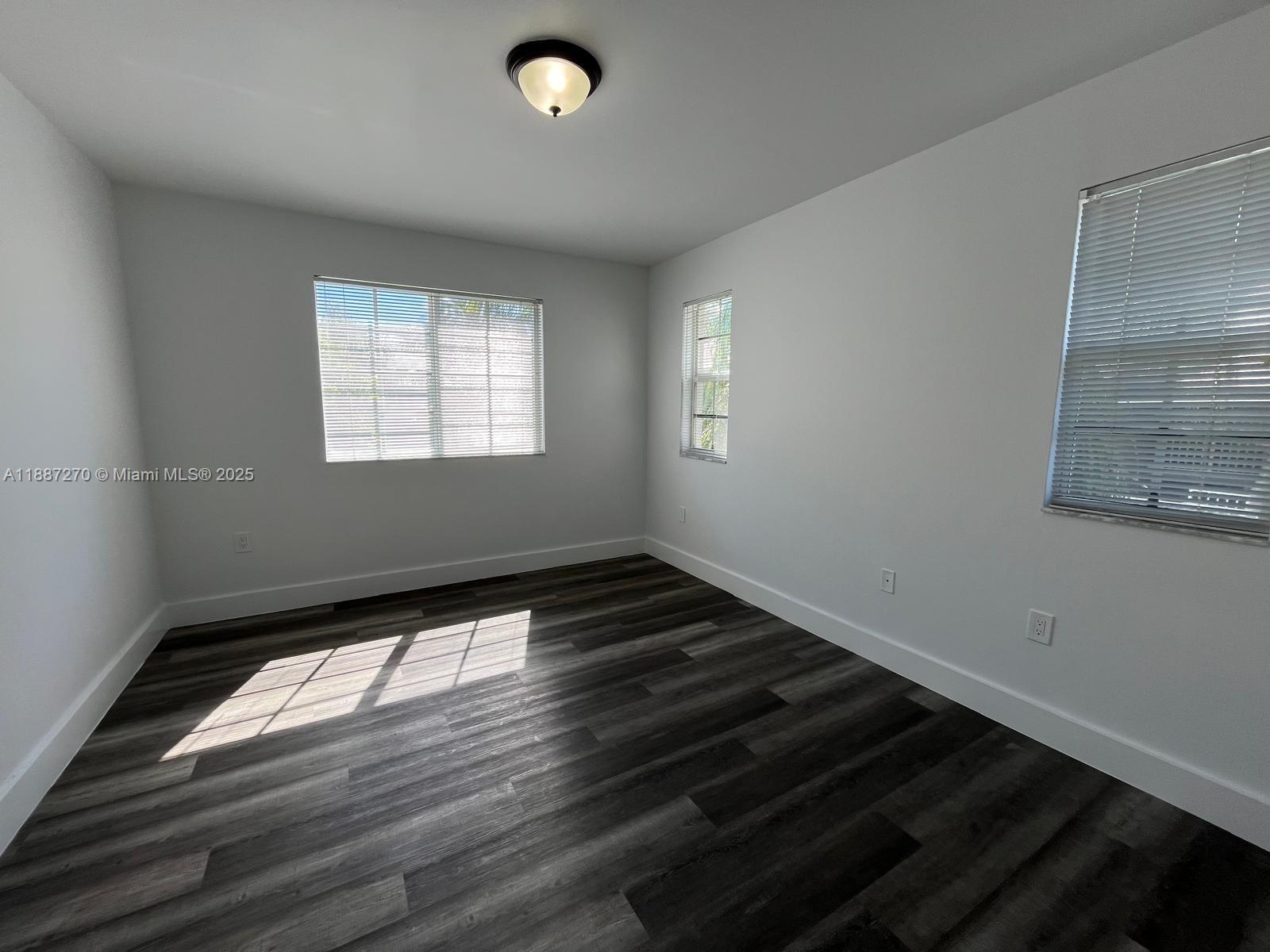 655 Southwest 111th Way, Unit 308 Pembroke Pines, FL 33025 - Photo 15 of 42 a view of an empty room and window