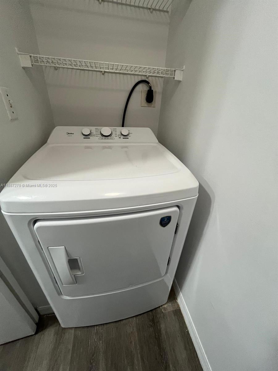 655 Southwest 111th Way, Unit 308 Pembroke Pines, FL 33025 - Photo 25 of 42 a utility room with washer and dryer