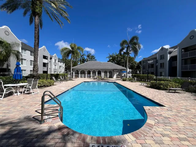 a view of a swimming pool with a patio