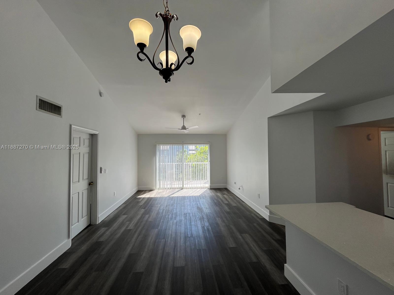 655 Southwest 111th Way, Unit 308 Pembroke Pines, FL 33025 - Photo 5 of 42 a view of an empty room with a window