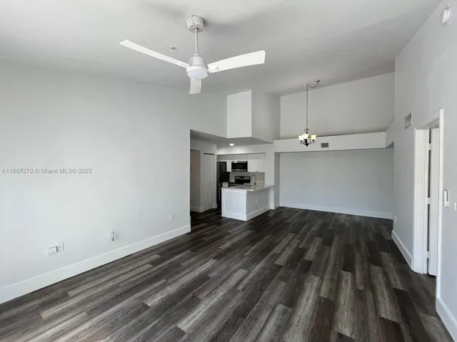 a view of a kitchen with a sink and dishwasher cabinets