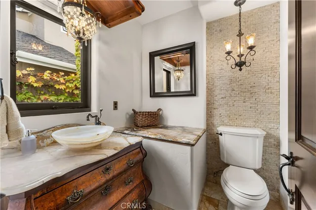 a bathroom with a sink a washer and dryer