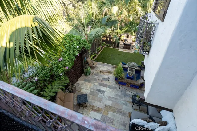 a bedroom with bed and wooden floor