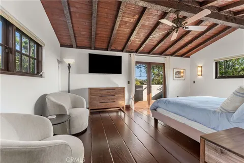 a view of a backyard with plants and a patio